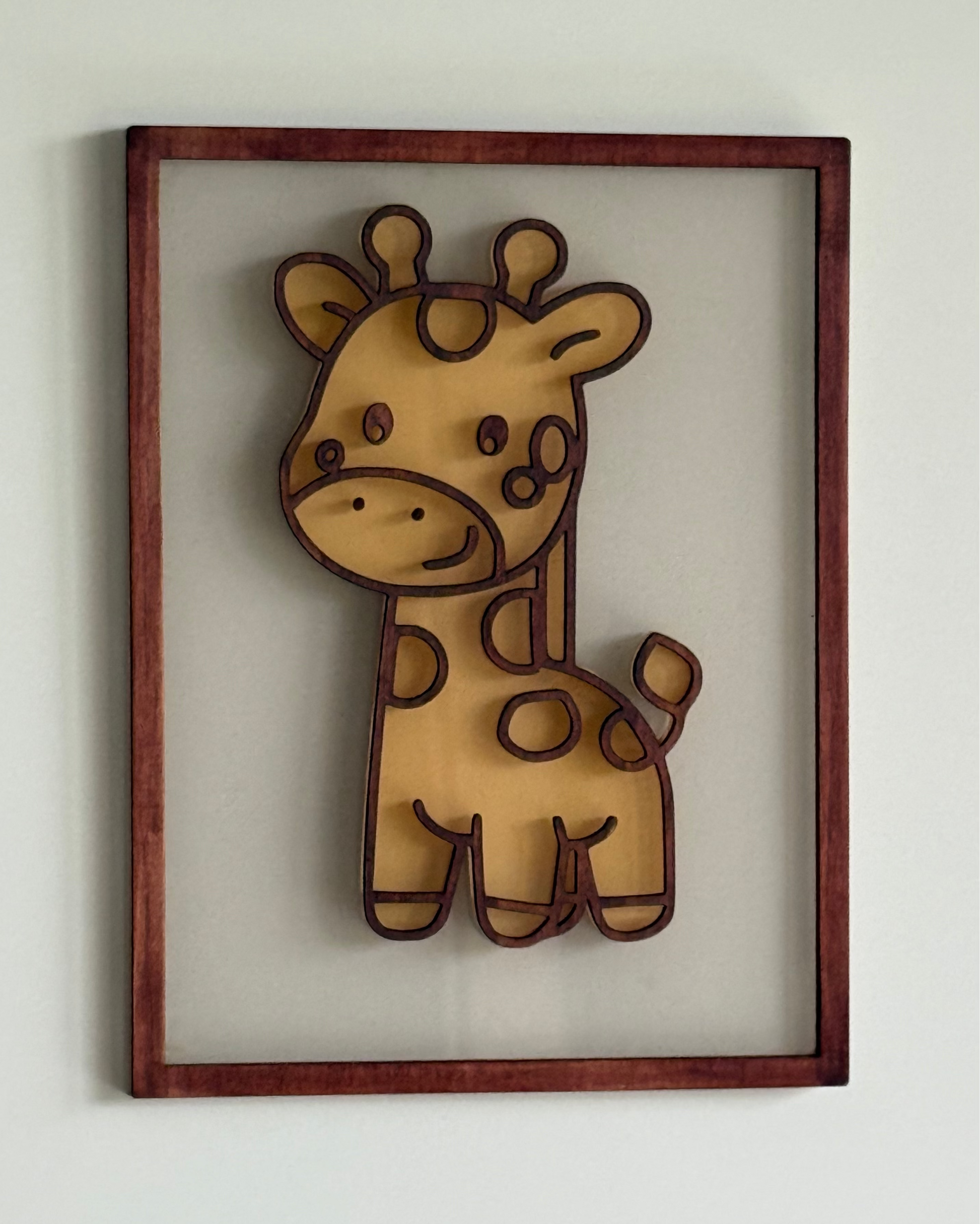 Framed illustration of a cartoon giraffe on a white background