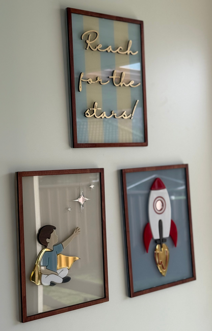 Decorative wall art with 'Reach for the stars!' 